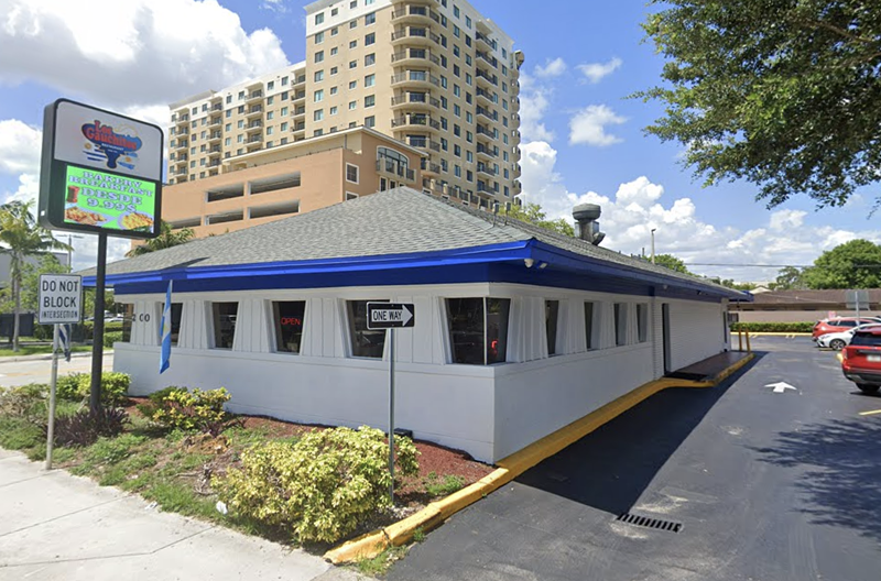 Image: a blue and white triangular building