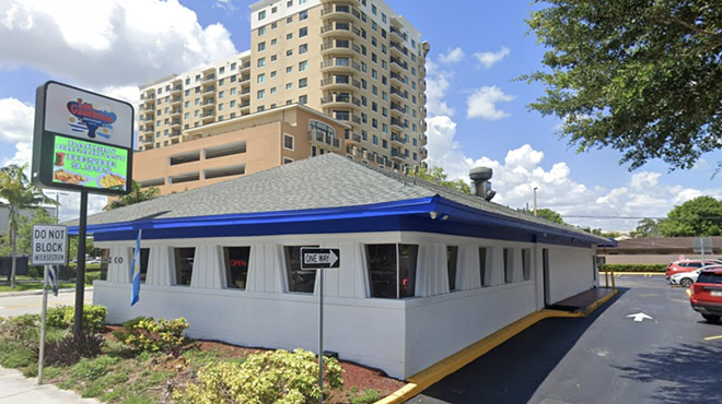 a blue and white triangular building