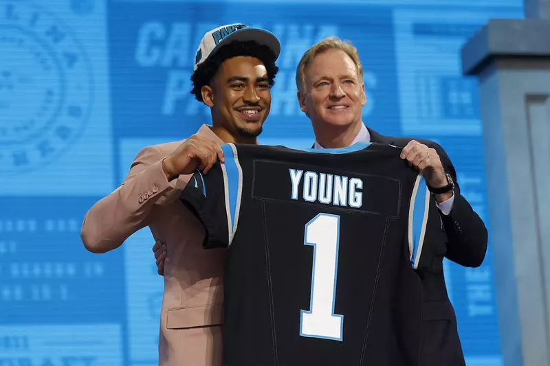 Image: Bryce Young, chosen by the Carolina Panthers with the first pick in the 2023 NFL Draft, poses with league commissioner Roger Goodell.