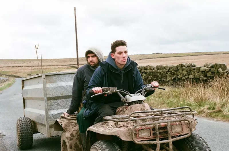 Image: Josh O’Connor (right) plays raw-eyed farm boy Johnny and Alec Secareanu is Gheorghe, a strapping yet tender Romanian, two characters who try a little tenderness in the rough hills of northern England in Francis Lee’s stark, striking God’s Own Country.