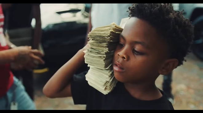 Nine-year-old rapper Lil RT carries a huge stack of cash