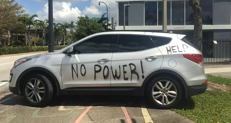Image: Spray-painted car parked on Miami's Upper Eastside.
