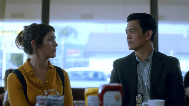 Image: Lola Kirke (left) plays Jill LeBeau, a movie star's assistant who emerges as the lead suspect for Detective Edward Ahn (John Cho) in writer-director Aaron Katz's Gemini, a shimmering puzzler set in Los Angeles.
