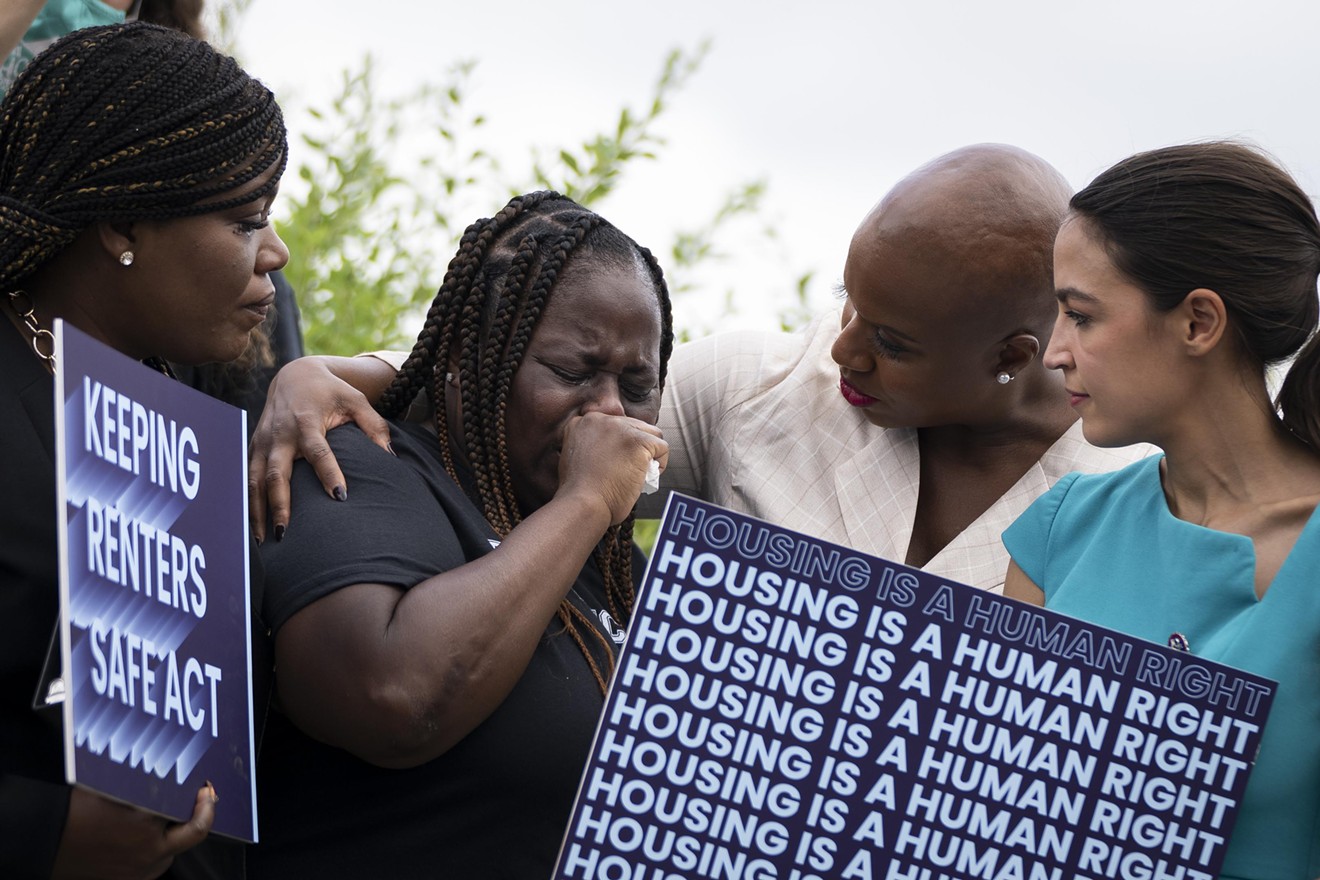 Vivian Smith, a single mother from Miami who was evicted from her home during the coronavirus pandemic, stands next to U.S. House representatives Cori Bush, Ayanna Pressley, and Alexandria Ocasio-Cortez during a news conference on eviction moratorium legislation on Capitol Hill on September 21, 2021, in Washington, DC.