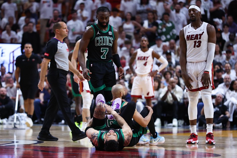 Bam Adebayo casts an incredulous gaze at Jayson Tatum as Tatum winces in pain after the two made light contact after a whistle blew in Game 4 of the first round of the 2024 NBA Playoffs.