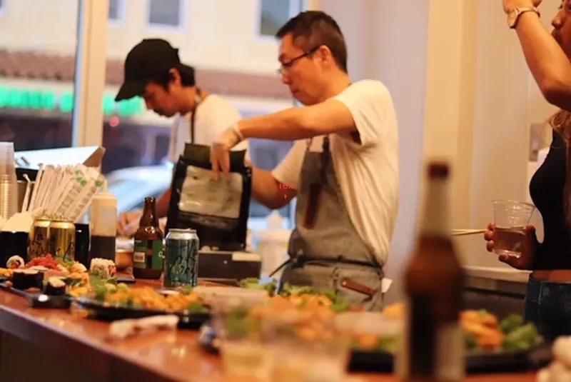Image: Chef Brian Koo (center)