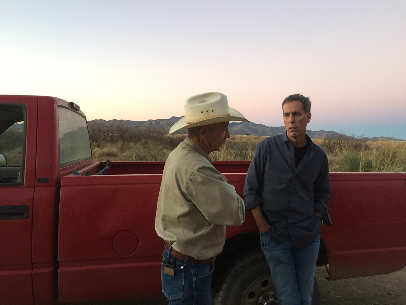John Ladd (left), a rancher near Bisbee, Arizona, who often appears in the press touting Donald Trump's border policies, appears with director-producer James D. Stern in American Chaos.