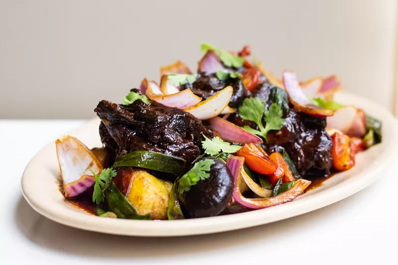 Image: The oxtail saltado preserves the essential ingredients from the traditional lomo saltado stir-fry while substituting the traditional tenderloin steak with a slow-braised oxtail.