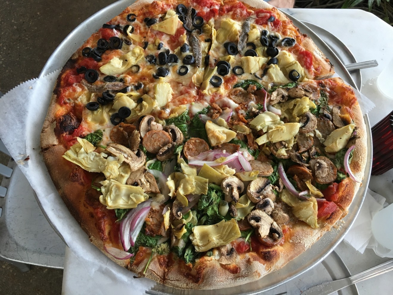 Andiamo lets customers customize their own whole or half 
pizza.