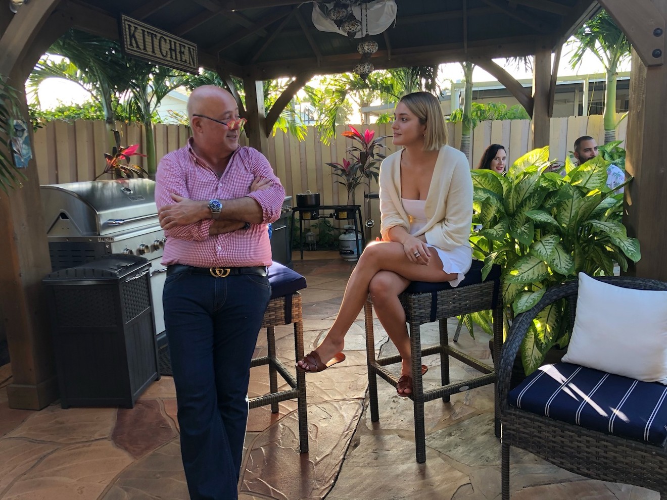 Andrew Zimmern visiting with Caja Caliente's Mika Leon
