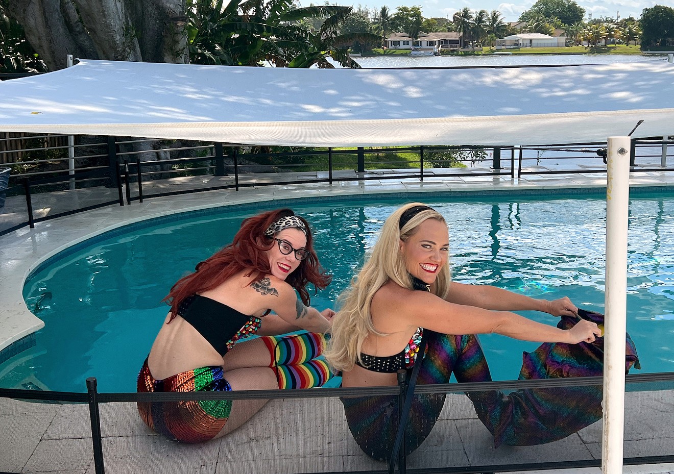 Aquaticats Janelle Smiley and Whitney Fair poolside before an underwater photoshoot