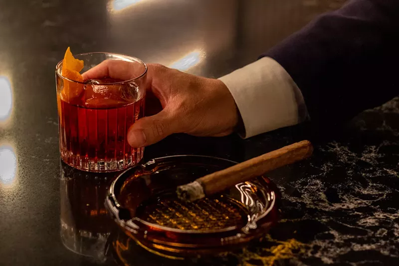 Image: Cigars and hella good cocktails? Yes and yes at El Vecino.
