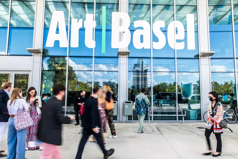 Image: People standing outside the Miami Beach Convention Center during Art Basel 2021.