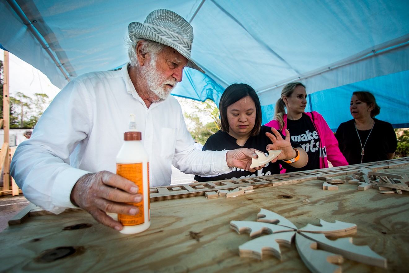 Artist David Best works with volunteers to build Temple of Time.