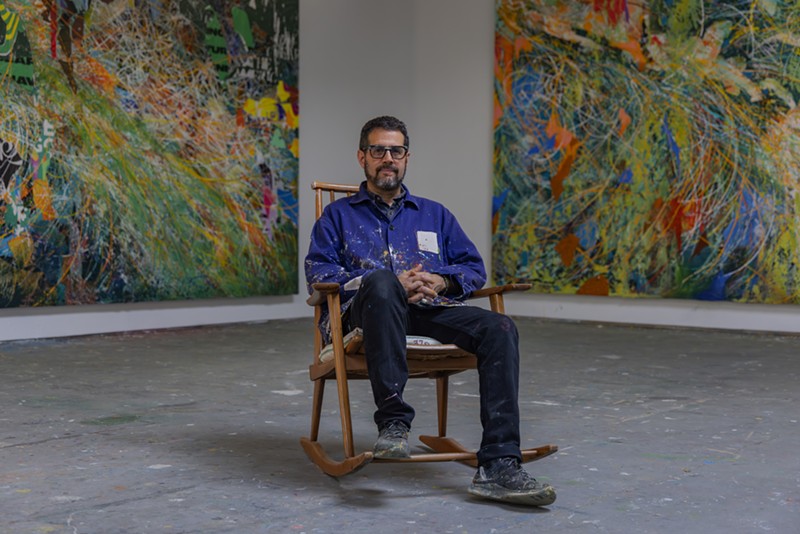 Artist José Parlá sits in his studio.