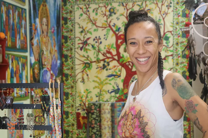 Image: Hattie Mae Williams poses inside her store, Hattie's House.