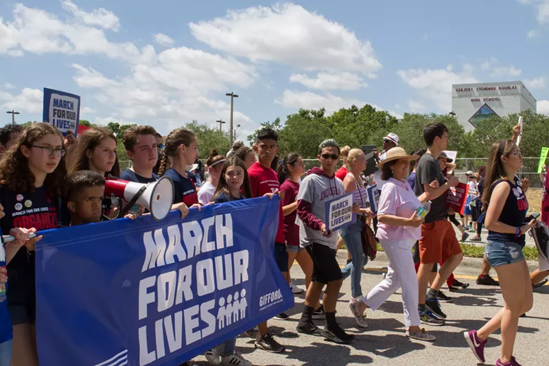 Image: On Saturday, Stoneman Douglas students led 20,000 people through Parkland and past their high school.