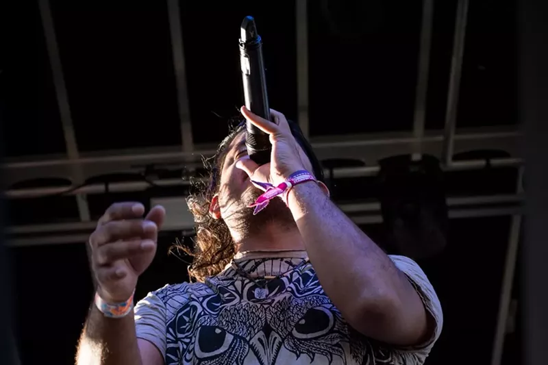 Image: Edilberto "Eddy" Morillo, lead singer of Bachaco, rocks a recent show at Virginia Key Park.