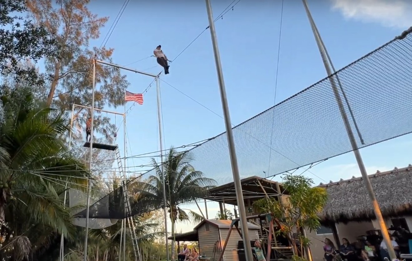 Trapeze artists fly high in Miguel Quintero's backyard.