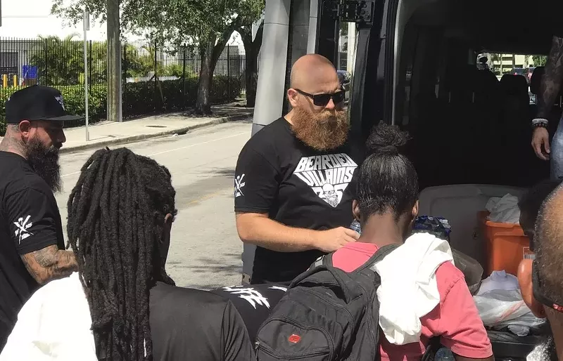 Image: The Villains handing out hygiene products and food to the homeless.