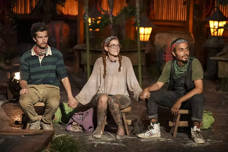 Image: Charlie Davis, Kenzie Petty, and Ben Katzman holding hands during the final ceremony of Survivor 46
