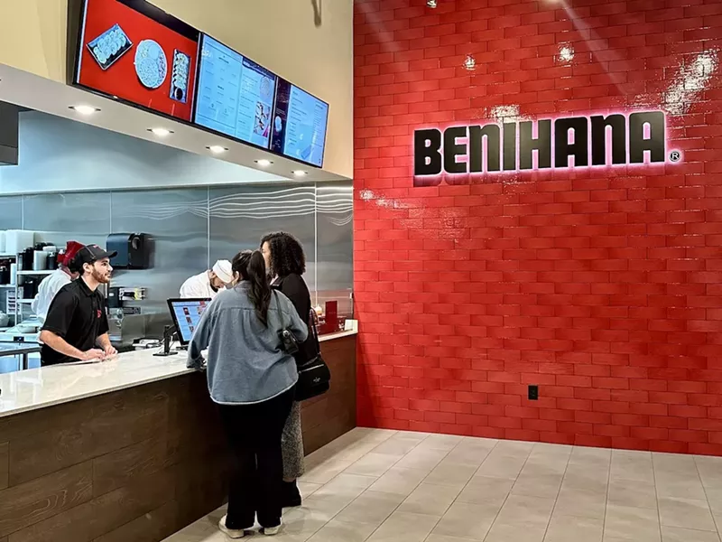 Image: A red ordering booth at a vendor