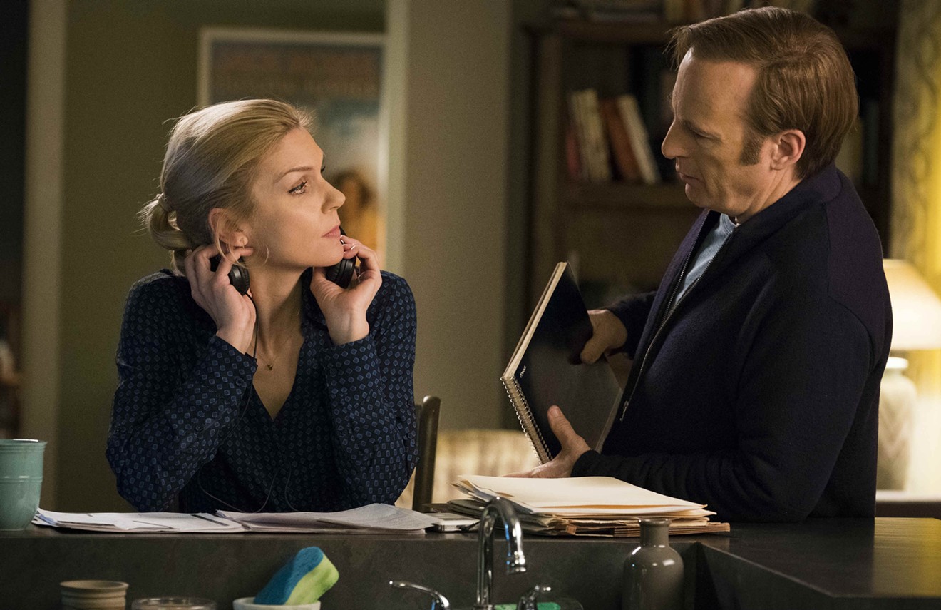 Bob Odenkirk (right) plays Saul Goodman, née Jimmy McGill, a shyster/lawyer with a fake name who gets down to business with his lawyer girlfriend, Kim Wexler (Rhea Seehorn), in the AMC drama Better Call Saul.