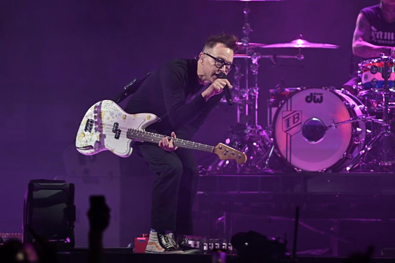 Blink-182's Mark Hoppus performing on stage at the Kaseya Center on Friday, June 21.