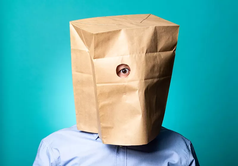 Image: photo of a person with a brown paper bag over their head.
