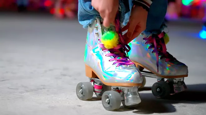 close-up of a pair of iridescent roller skates