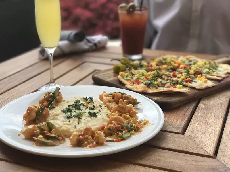Image: Shrimp 'n' grits and a breakfast flatbread are on the menu at Brimstone's new bottomless brunch at CityPlace Doral.