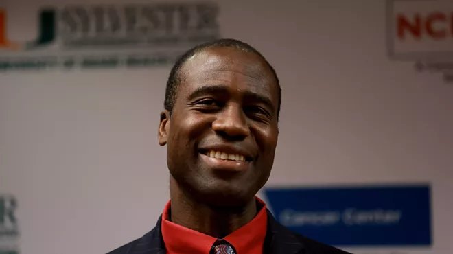Florida's surgeon general smiles at a Miami press conference