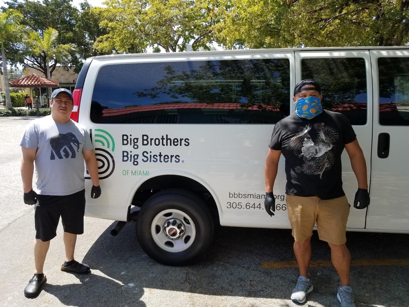 Big Brothers Big Sisters delivering food to local families.