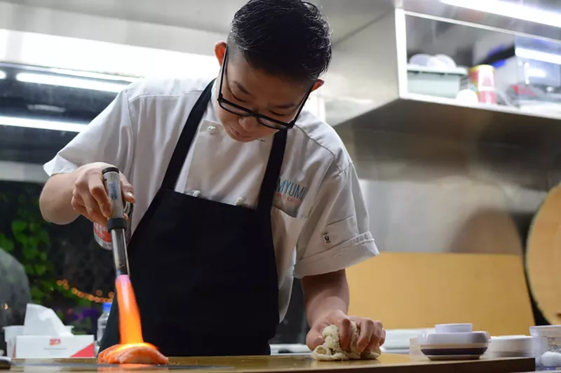 Image: Myumi's Ryo Kato torches salmon.
