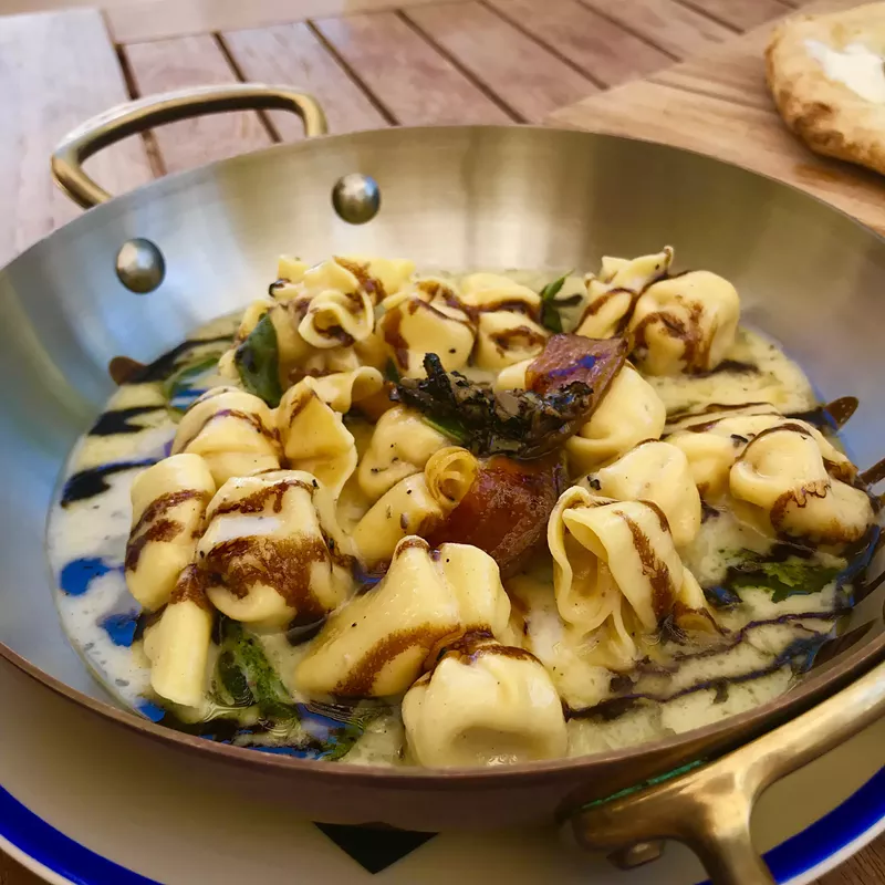 Image: Fiocchetti alle pere e tarfuto: Handmade pasta filled with truffle cream and caramelized pear.