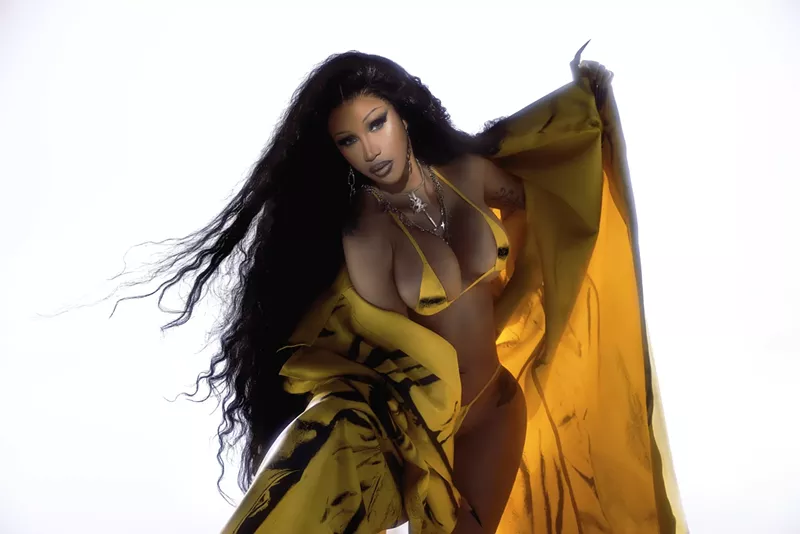 Image: Portrait of Cardi B wearing a yellow bikini