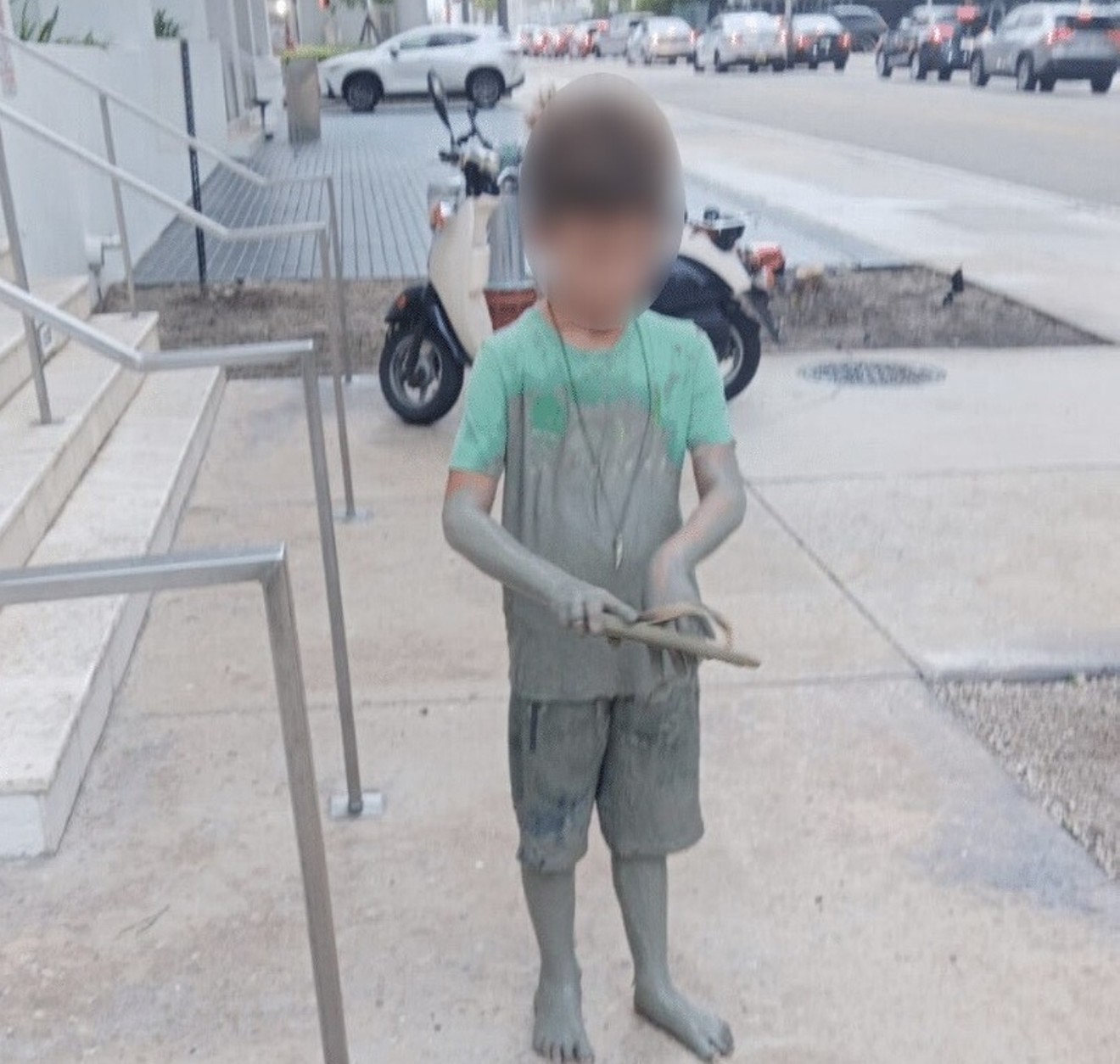 The child emerged covered in cement after falling into the downtown Miami pit.