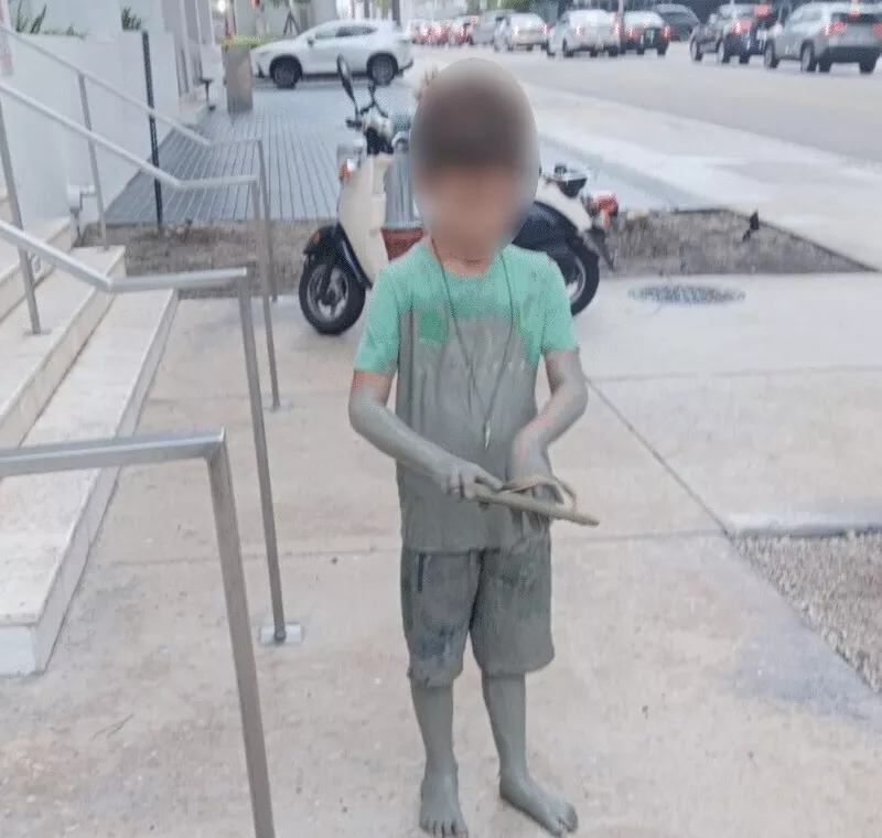 Image: The child emerged covered in cement after falling into the downtown Miami pit.