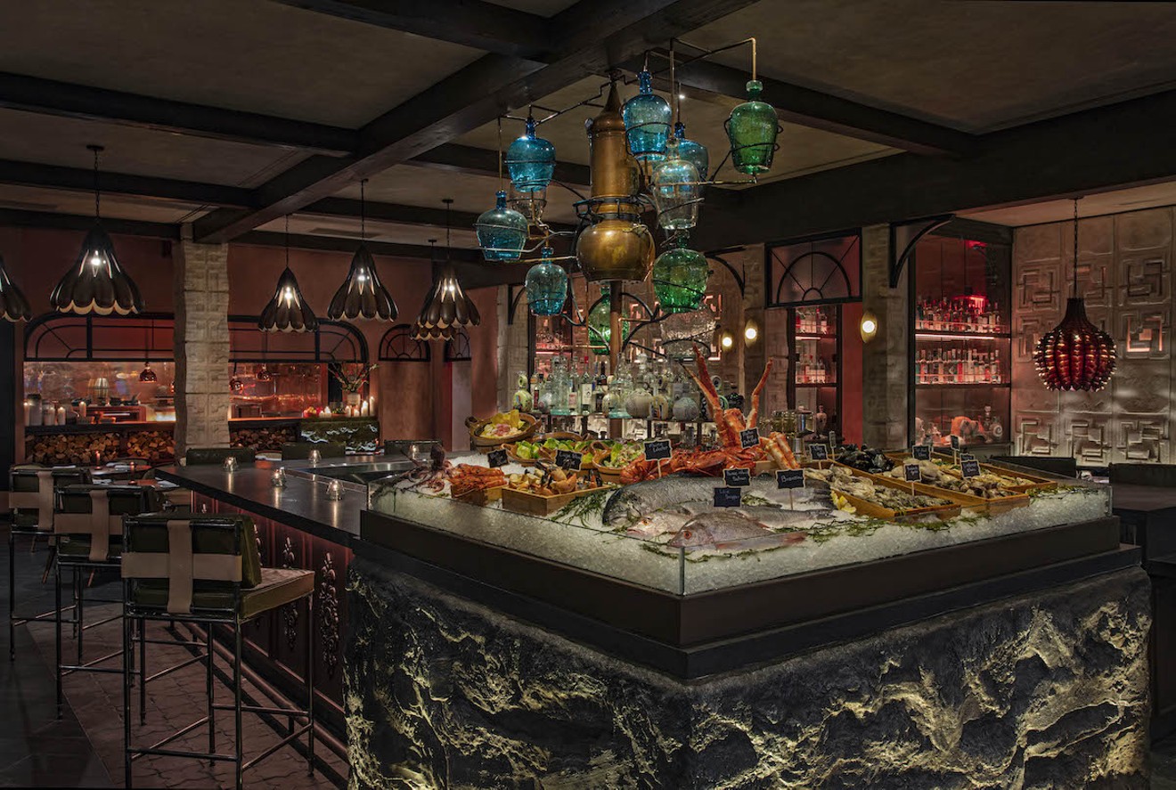 The tequila tree dispenses mezcal and tequila at the bar inside Moxy Miami South Beach's new seafood restaurant Como Como.