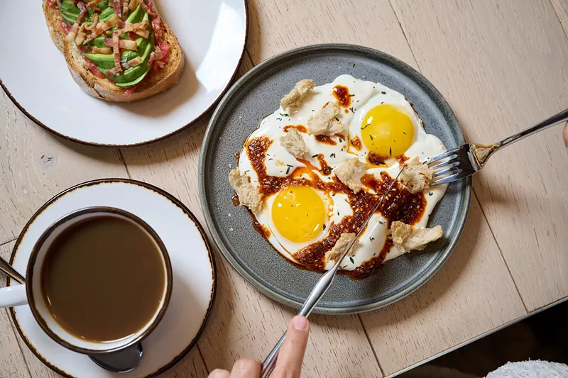 Image: Two dishes on plates on a wooden table