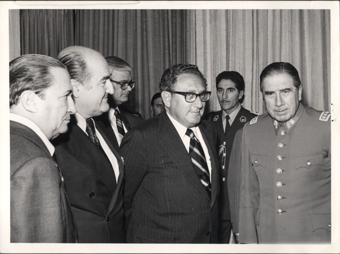Former Secretary of State Henry Kissinger (middle) meeting ex-Chilean dictator Augusto Pinochet in 1975.