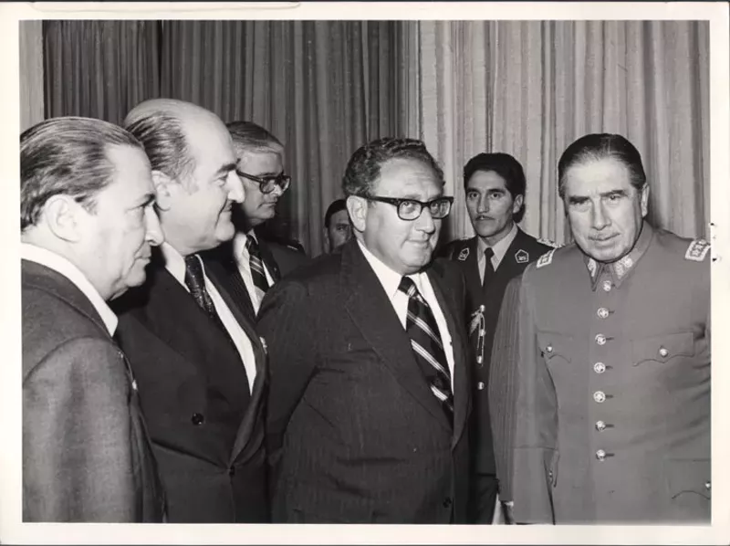 Image: Former Secretary of State Henry Kissinger (middle) meeting ex-Chilean dictator Augusto Pinochet in 1975.