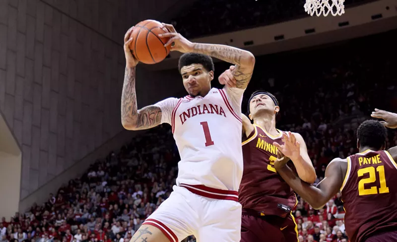 Image: Kel'el Ware pulls in a rebound with a ball over his head