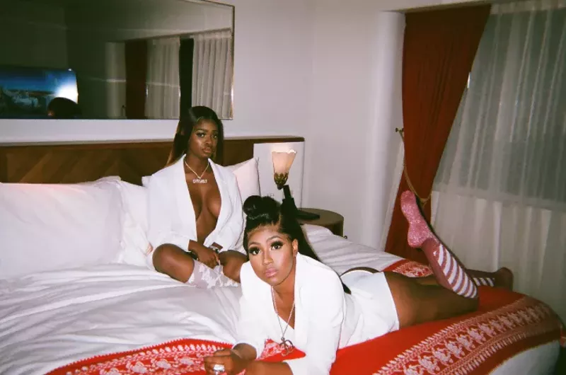 Image: City Girls' JT (background) and Yung Miami.