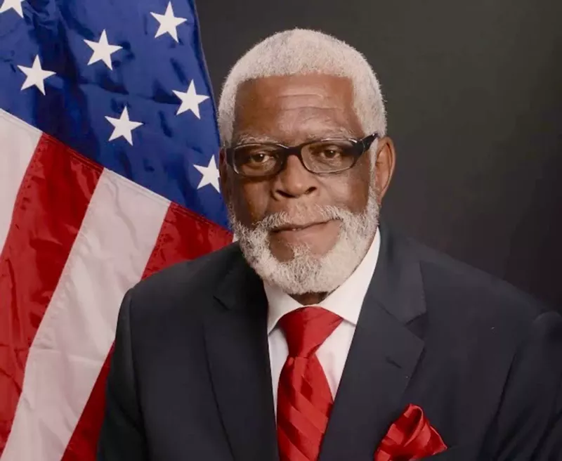 Image: Ex-mayor and current commissioner John B. Riley