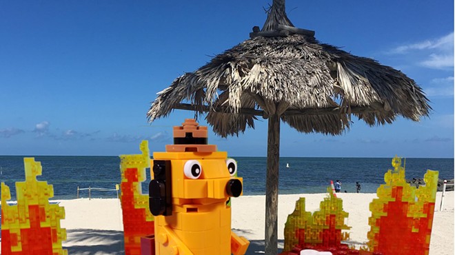 Lego and seaside play on the K.C. Green "This is Fine" meme