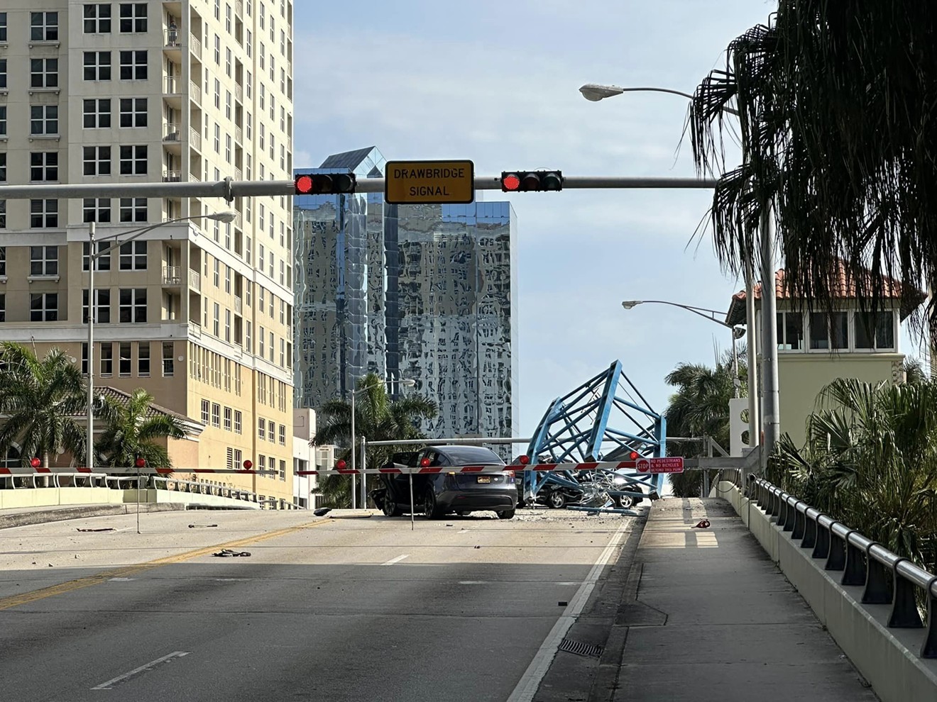 A section of a high-rise construction crane fell onto the SE 3rd Avenue bridge in Fort Lauderdale, smashing a car, on April 4, 2024.