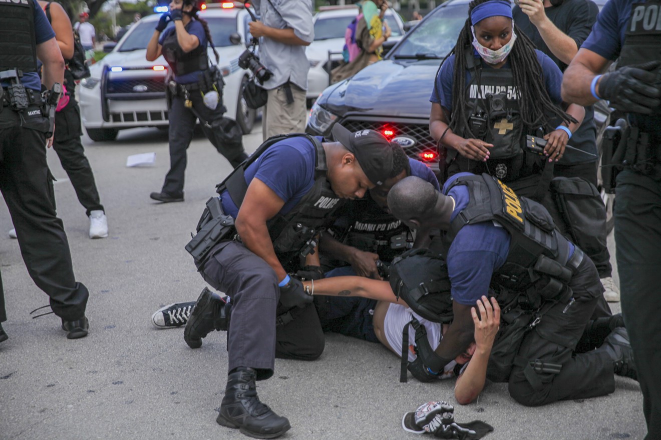 Miami police arrest protesters on June 10.
