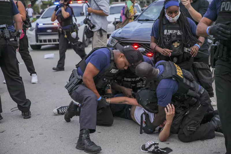 Image: Miami police arrest protesters on June 10.
