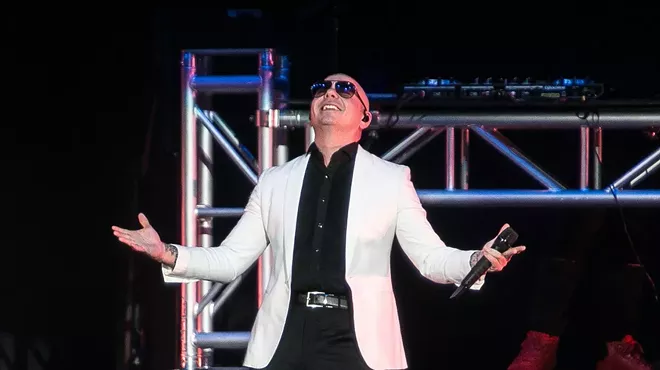 Pitbull performing on stage as part of Miami Bash on April 15, 2018